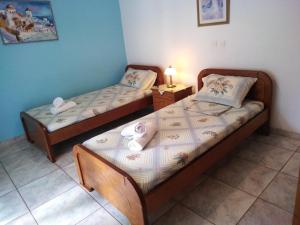 A bed or beds in a room at 85 sqm Apartments New Panorama ELECTRIC CAR ΦΩΡΤΗΣΗΣ STATION