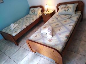 A bed or beds in a room at 85 sqm Apartments New Panorama ELECTRIC CAR ΦΩΡΤΗΣΗΣ STATION