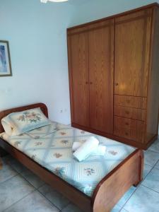 A bed or beds in a room at 85 sqm Apartments New Panorama ELECTRIC CAR ΦΩΡΤΗΣΗΣ STATION