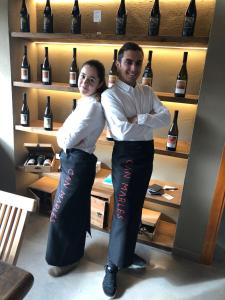 a man and woman standing in front of a shelf of wine bottles at CAL PUIG, ENOTURISMO RURAL entre Viñas y Bosques in Juncosa +132 photos