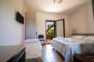 Postel nebo postele na pokoji v ubytování Hotel Eden