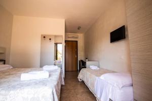 Postel nebo postele na pokoji v ubytování Hotel Eden