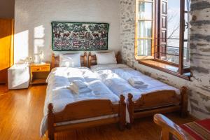 Posteľ alebo postele v izbe v ubytovaní Archontiko Montana
