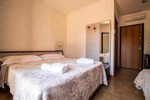 Postel nebo postele na pokoji v ubytování Hotel Eden