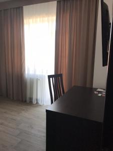 TV a/nebo společenská místnost v ubytování Neopolis