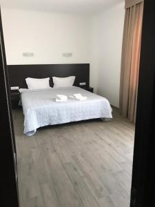 Postel nebo postele na pokoji v ubytování Neopolis