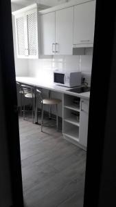 Kuchyň nebo kuchyňský kout v ubytování Neopolis
