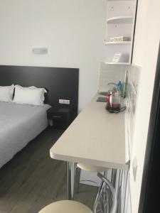 Postel nebo postele na pokoji v ubytování Neopolis