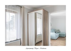 Postel nebo postele na pokoji v ubytování Vigan Apartamenty