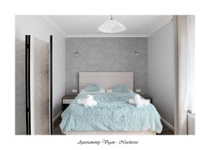 Postel nebo postele na pokoji v ubytování Vigan Apartamenty