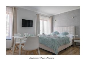 Postel nebo postele na pokoji v ubytování Vigan Apartamenty