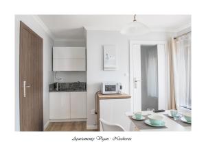 Kuchyň nebo kuchyňský kout v ubytování Vigan Apartamenty