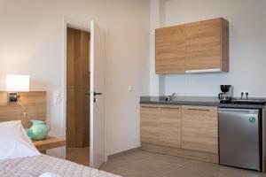 a kitchen with a sink and a counter top at Euphoria Blue studio apartments in Artemida