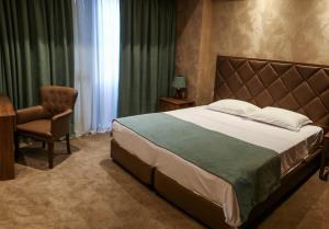Postel nebo postele na pokoji v ubytování Boutique Hotel Mimino
