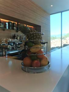 a pile of fruit on a counter in a kitchen at Hotel Olea in Novalja