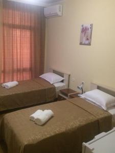 Rúm í herbergi á Hotel Medusa