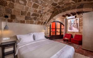 Tempat tidur dalam kamar di Zacosta Villa Hotel