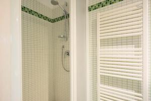 a bathroom with a shower and a glass door at Dimora Ricceri in Impruneta +23 photos