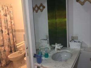 a bathroom with a sink and a toilet at Casa Loretta in Perugia