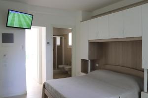 מיטה או מיטות בחדר ב-Antares