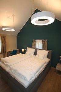 Een bed of bedden in een kamer bij Péitche Lauer
