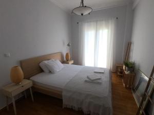 Posteľ alebo postele v izbe v ubytovaní Athens Downtown Boho Apartment 1 min from metro