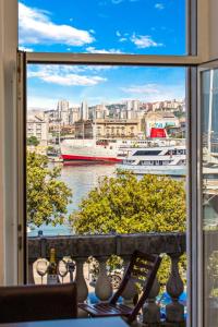 a view of a harbor from a window at Apartment Mia in Rijeka