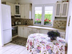 Kuchyň nebo kuchyňský kout v ubytování Guests house "Like Home"