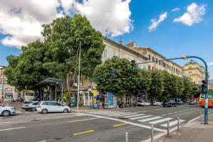 a busy city street with a traffic light and buildings at Apartments Carpathia in Rijeka