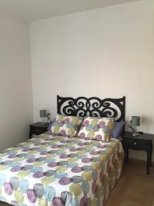 En eller flere senge i et værelse på Baja Larga