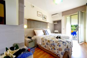 Postel nebo postele na pokoji v ubytování Hotel Colorado