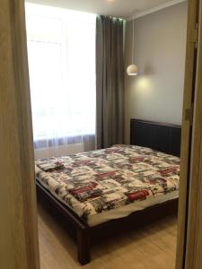 מיטה או מיטות בחדר ב-36 jemchujina