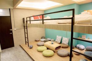 a room with two bunk beds and a play area at BIRD series B&B&Hostel複合式民宿#本國旅客須先匯款 in Tainan