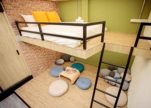 a small room with two bunk beds and balls at BIRD series B&B&Hostel複合式民宿#本國旅客須先匯款 in Tainan