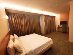Postel nebo postele na pokoji v ubytování Prescott Hotel Bukit Bintang + 37 fotografií