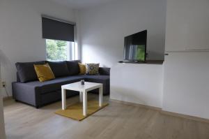 En tv och/eller ett underhållningssystem på Appartement Jemeppe-Bierset-Liège