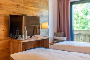 Letto o letti in una camera di Stadtvilla Schladming Boutiquehotel