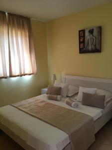 Ein Bett oder Betten in einem Zimmer der Unterkunft Apartments Sanja