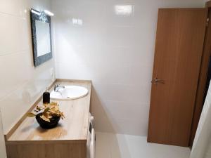 a bathroom with a sink and a mirror at Living Burgos in Burgos +29 photos