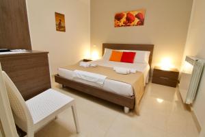 A bed or beds in a room at B&B Pietramare