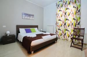 A bed or beds in a room at B&B Pietramare