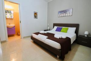 A bed or beds in a room at B&B Pietramare