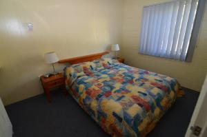 Postel nebo postele na pokoji v ubytování Forest Lodge Apartments