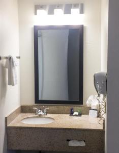 a bathroom with a sink and a mirror at Sleep Inn Chattanooga Hamilton Place in Chattanooga