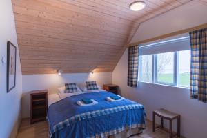 Postel nebo postele na pokoji v ubytování Skyrhusid HI Hostel