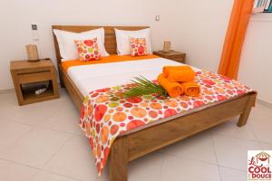A bed or beds in a room at La COOL & DOUCE - Villa DOUCE