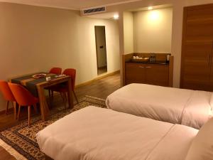 Postel nebo postele na pokoji v ubytování Hotel Fehmi Bey - Special Category