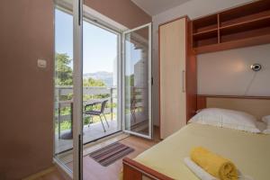 Posteľ alebo postele v izbe v ubytovaní Vita Apartments