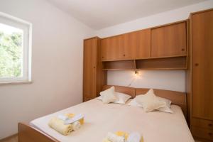 Posteľ alebo postele v izbe v ubytovaní Vita Apartments