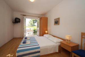 Posteľ alebo postele v izbe v ubytovaní Vita Apartments